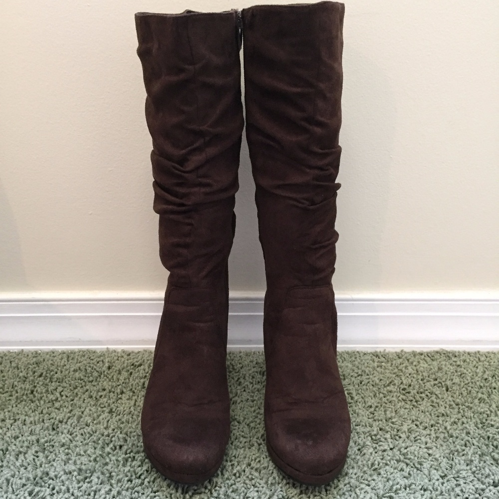 Suede knee length brown boots.